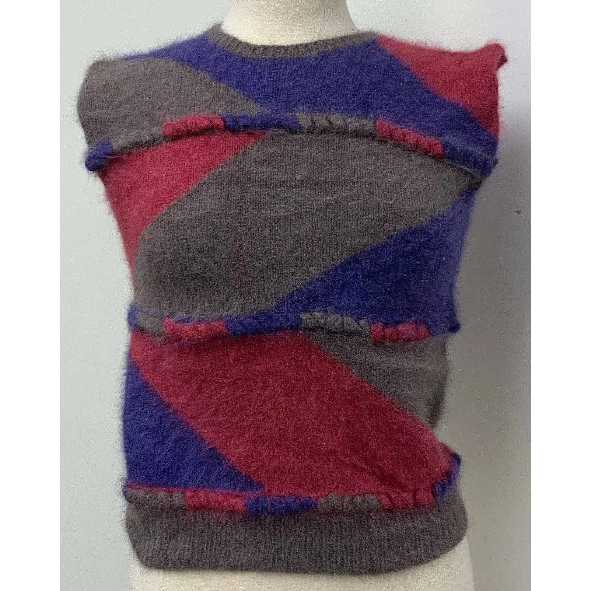 1980 pullover sweater vest designed  by Anny Blatt. Yarns are all 100% long hair French. Hand knit and never worn. SMALL